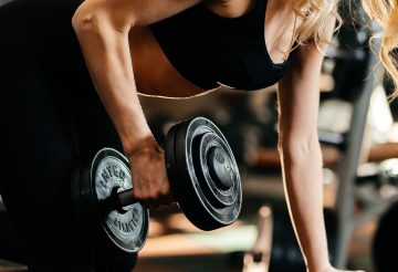 Focused woman lifting a dumbbell, highlighting strength and fitness goals. — Buy MK677 Australia: Promoting Muscle Growth and