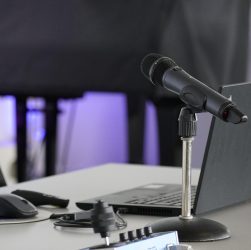 Laptop, conference table, mouse — Discover Nuru Massage in the UK for Ultimate Comfort and Relaxation