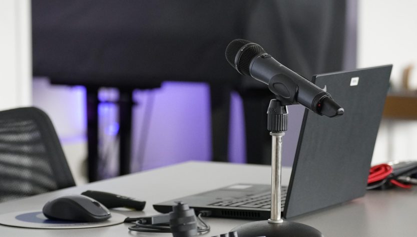 Laptop, conference table, mouse — Discover Nuru Massage in the UK for Ultimate Comfort and Relaxation