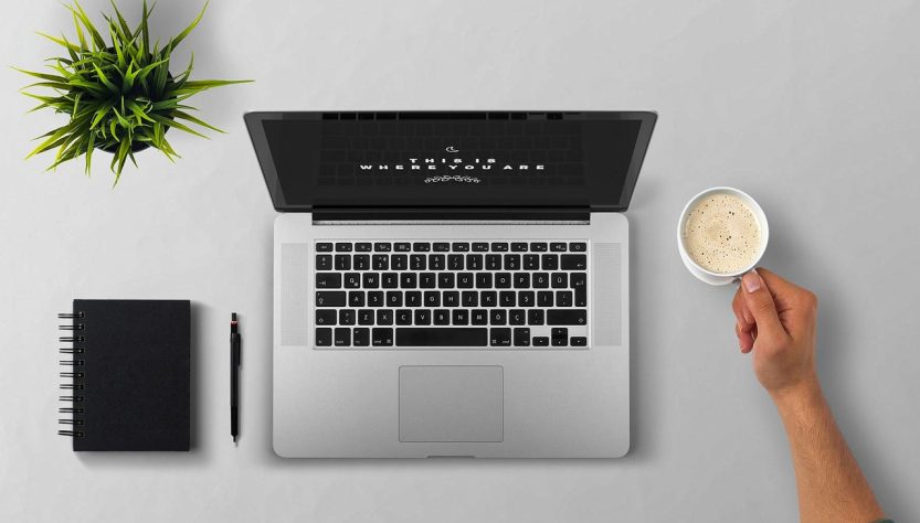 Laptop, coffee, arm — Get Maximum Return on Your Investment by Investing in Quality YouTube Views