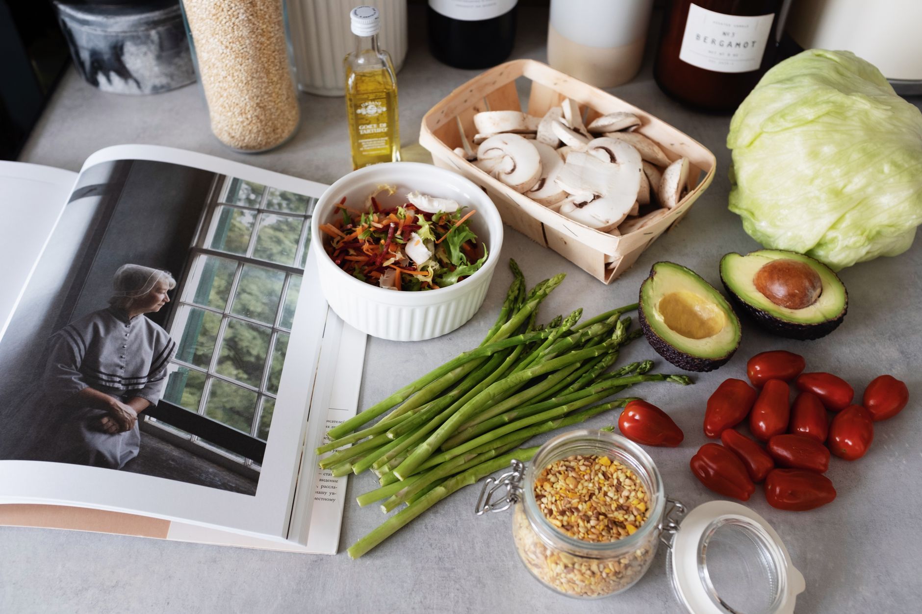 A selection of fresh vegetables and a cookbook in a kitchen setting, promoting healthy cooking. — Importance Of Document Mana