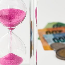 Hourglass, money, time — IronFX and the Future of CFD Trading: Trends and Predictions