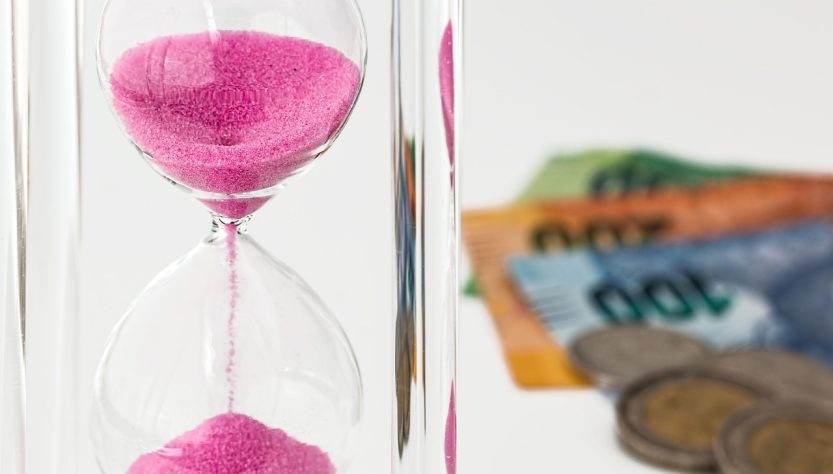 Hourglass, money, time — IronFX and the Future of CFD Trading: Trends and Predictions