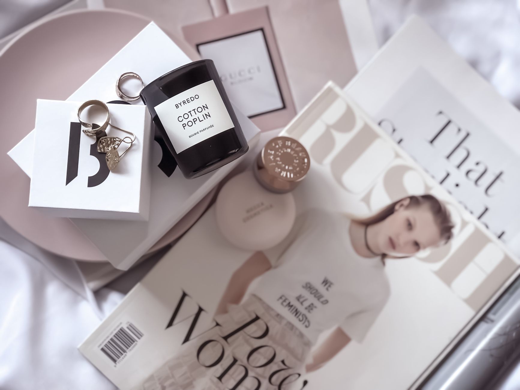 Stylish flat lay featuring fashion magazines, Byredo candle, and accessories. — Life Changing Benefits Of Core Strength