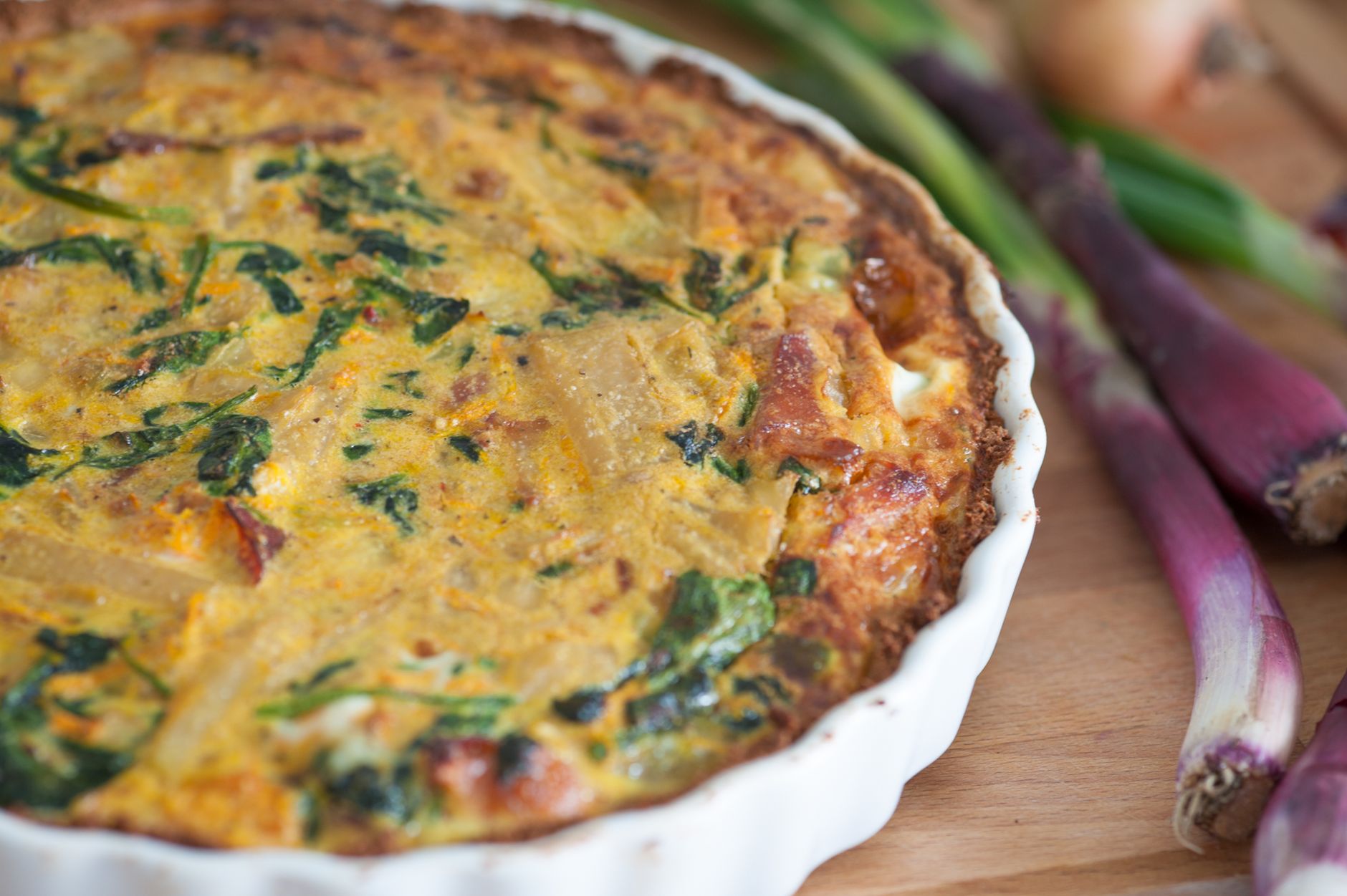 Delicious homemade quiche with fresh red onions and spinach, perfect for a tasty meal. — Omega-3: The Good Fat for Good Healt