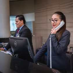 Receptionists, phone call, hotel — The Future of Cannabis Shopping: Canadian Online Dispensaries Explained